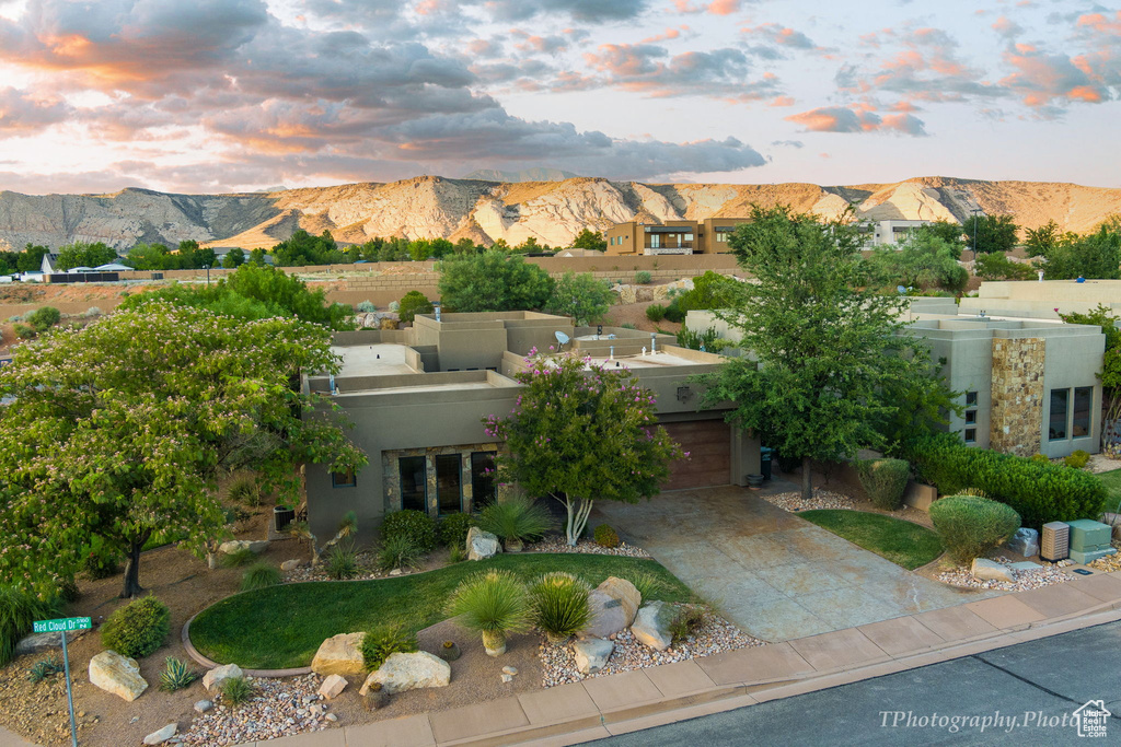 Aerial view at dusk featuring a mountain view