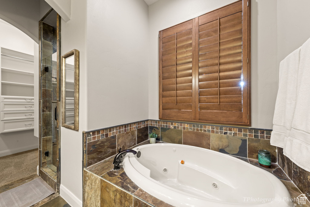 Bathroom with shower with separate bathtub