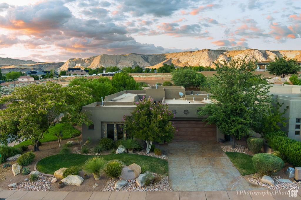 Exterior space featuring a mountain view and a garage