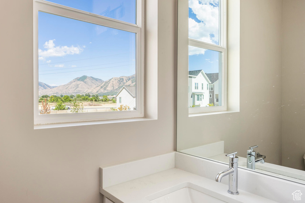 Bathroom with a mountain view and vanity