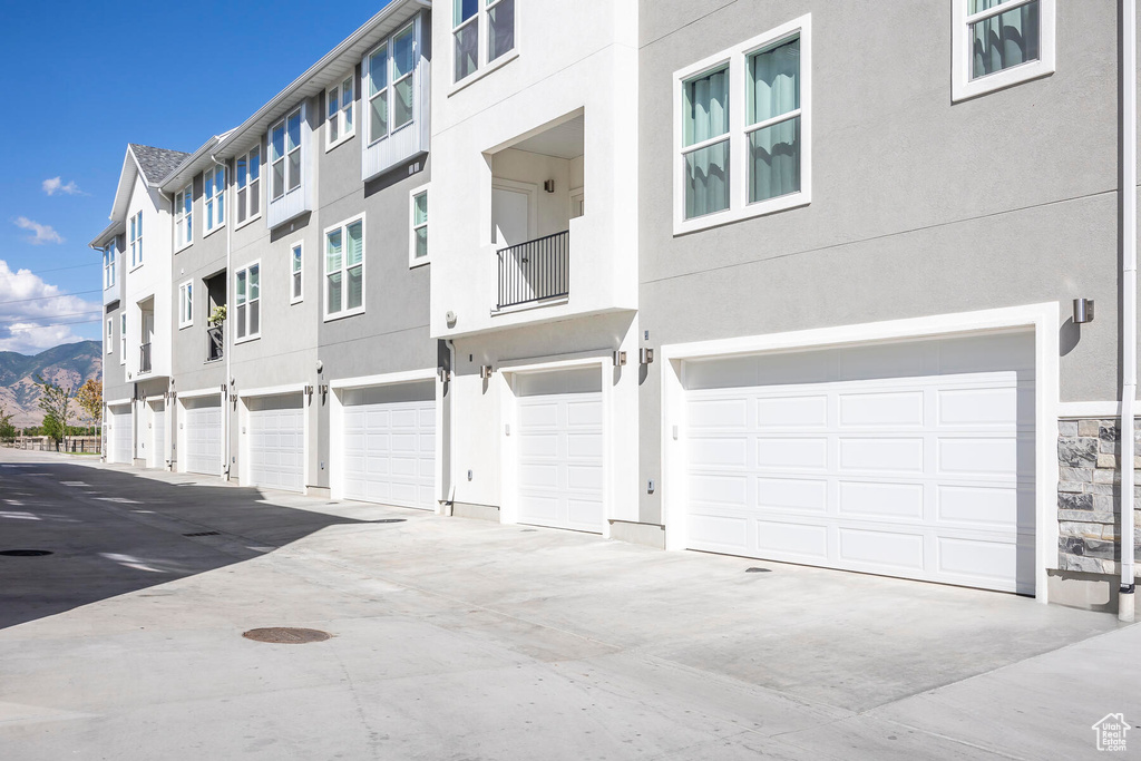 Exterior space featuring a mountain view and a garage