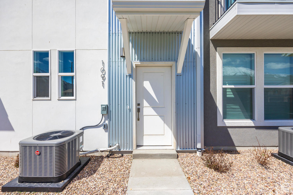 Entrance to property with central AC unit