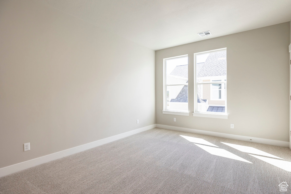 View of carpeted spare room