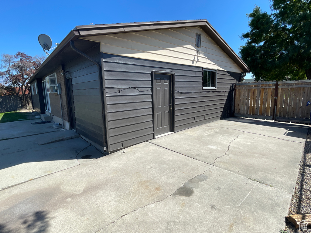 View of property exterior featuring a patio