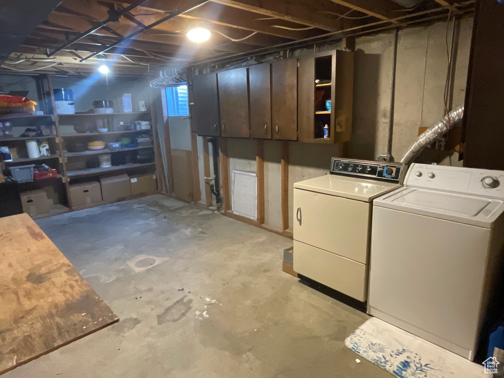 Basement featuring washer and clothes dryer