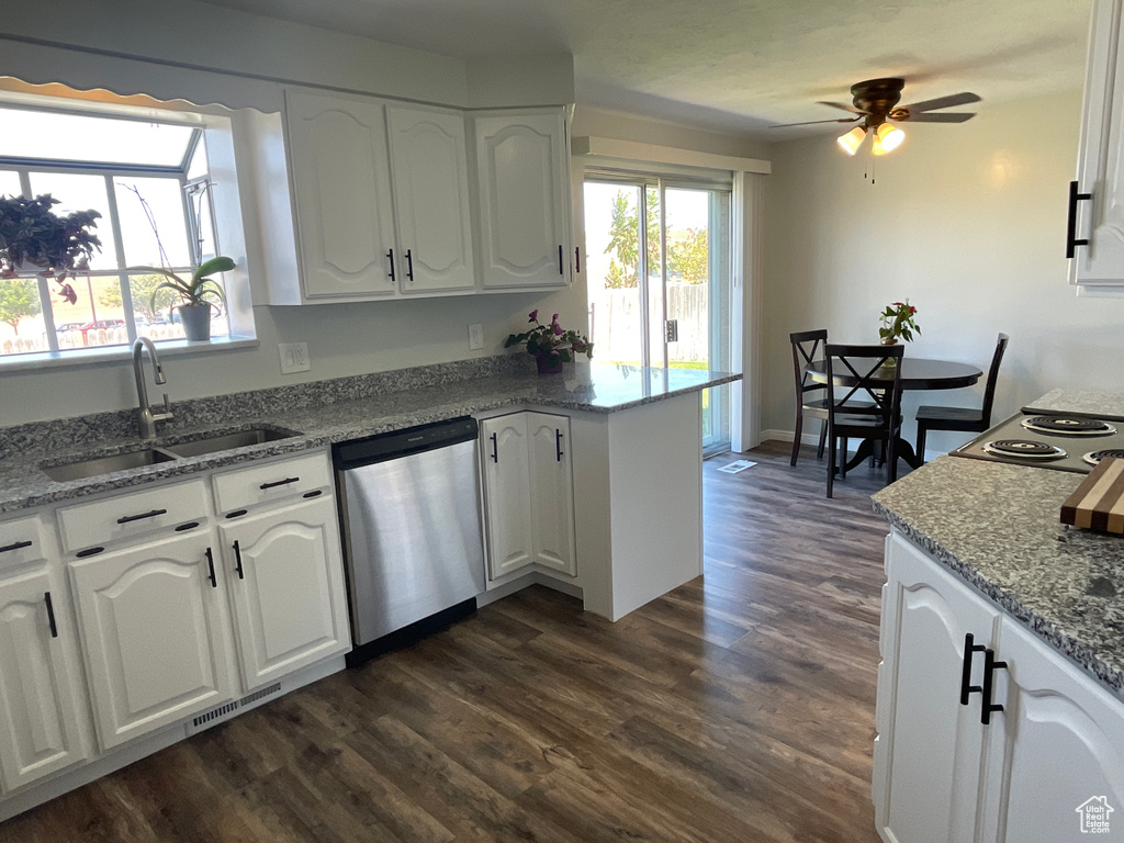 Kitchen featuring white cabinetry, sink, ceiling fan, dark hardwood / wood-style floors, and stainless steel dishwasher