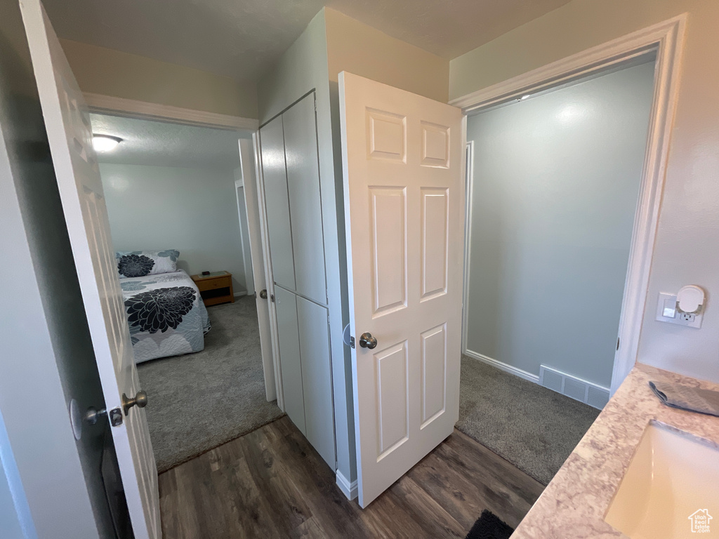 Bathroom featuring sink and hardwood / wood-style flooring