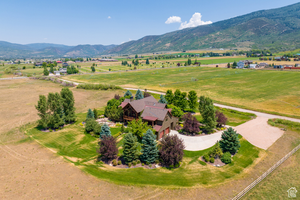 Drone / aerial view with a mountain view and a rural view