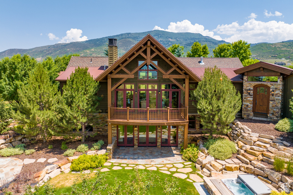 Exterior space with a mountain view and a patio area