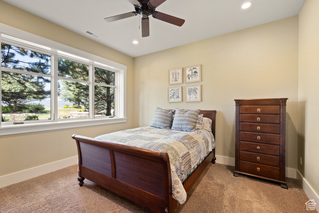 Bedroom with carpet flooring and ceiling fan