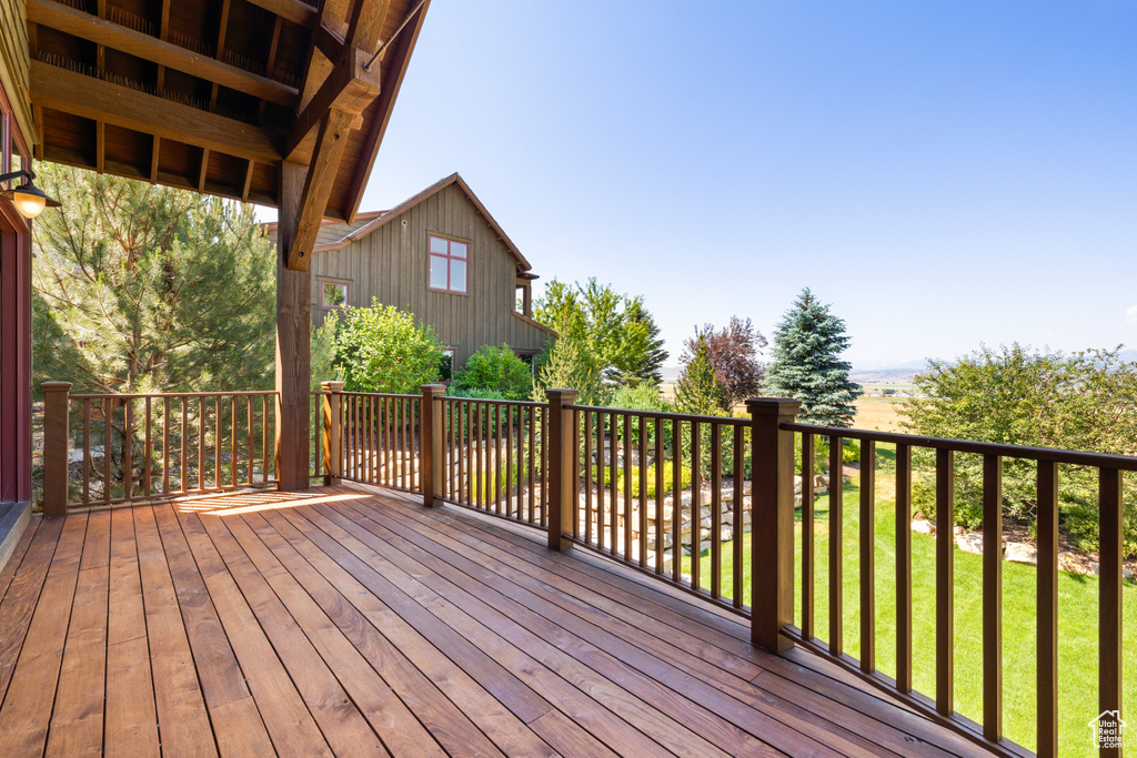 Wooden deck featuring a yard