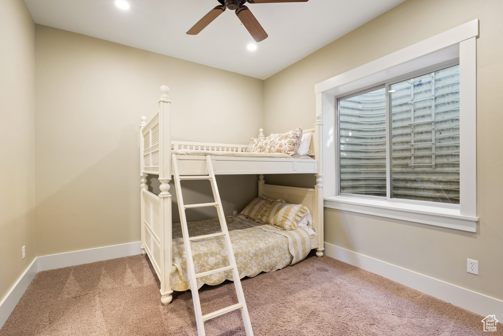 Bedroom with carpet flooring and ceiling fan