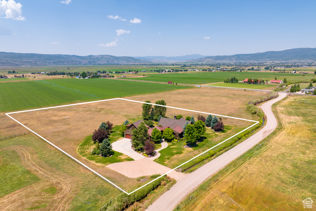 Birds eye view of property featuring a mountain view and a rural view