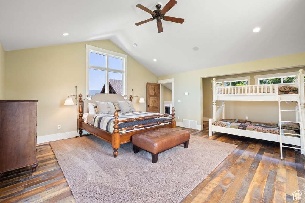 Bedroom featuring lofted ceiling, dark wood-type flooring, and ceiling fan