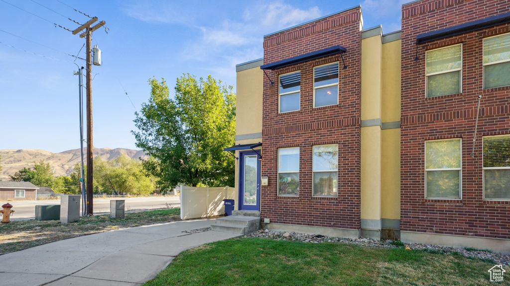 View of front of property with a mountain view