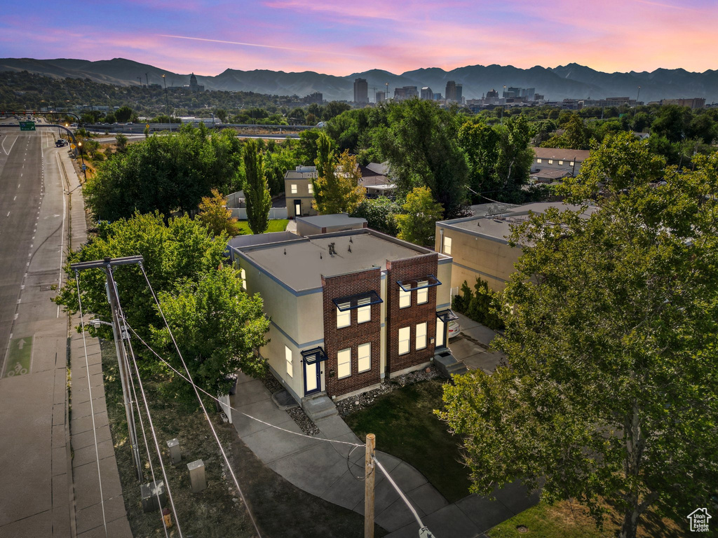 Aerial view at dusk featuring a mountain view