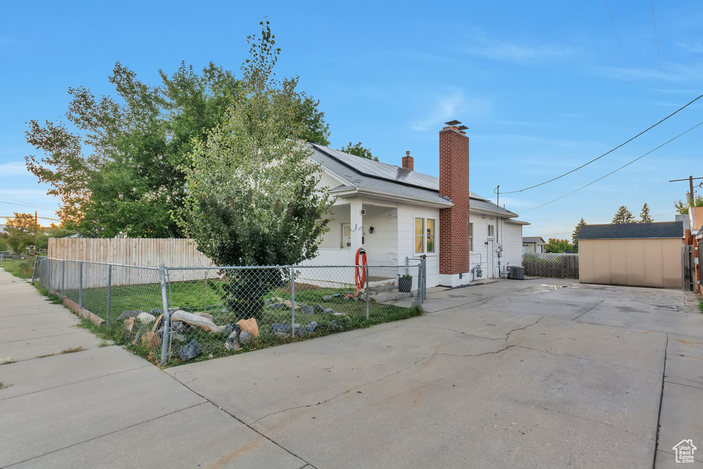 View of front of house with a storage unit