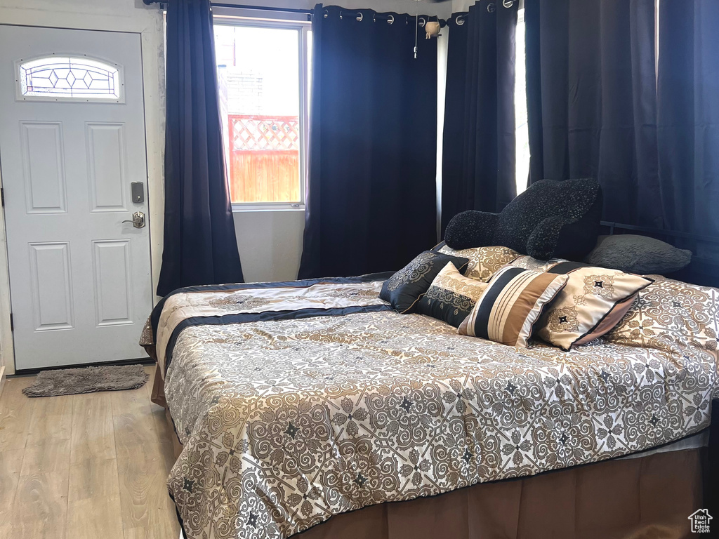 Bedroom with recessed lighting, a textured ceiling, and wood finished floors