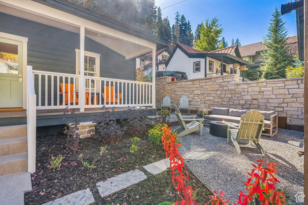 View of patio with an outdoor hangout area