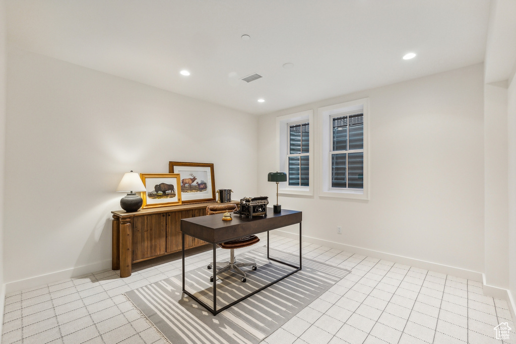 Office space with light tile patterned floors