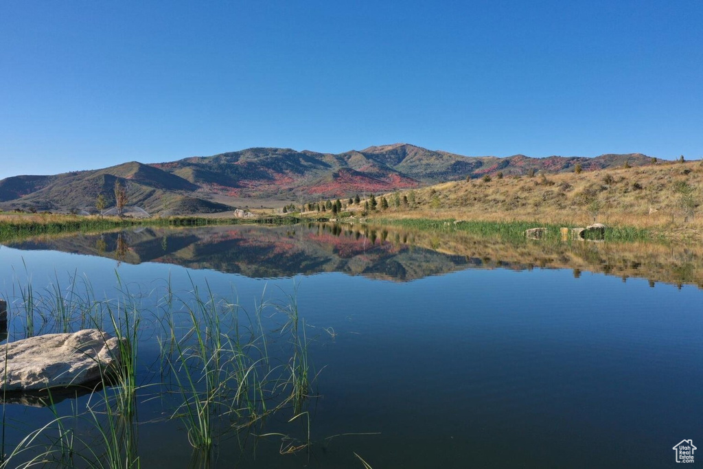 Property view of water with a mountain view