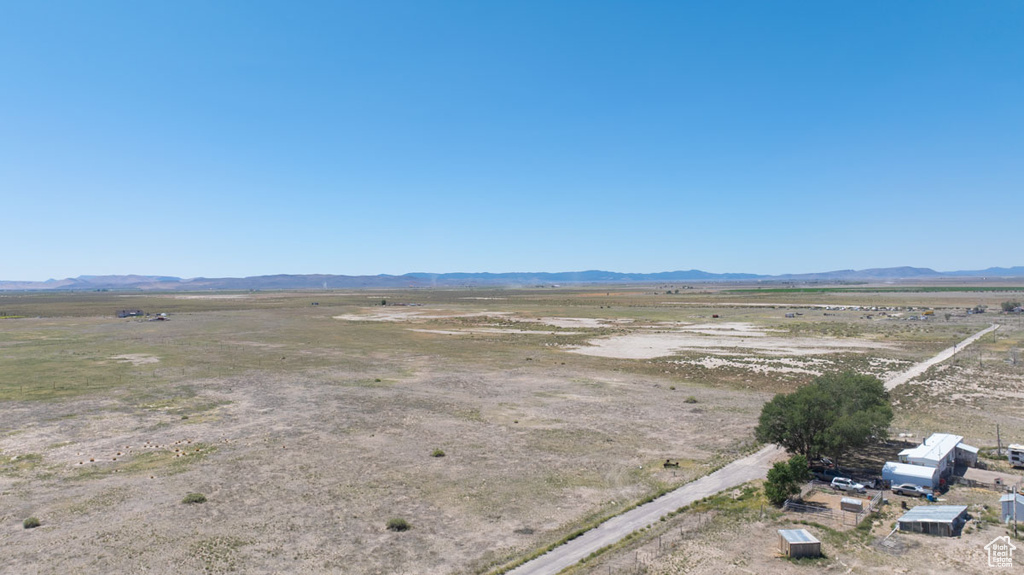 Birds eye view of property featuring a mountain view and a rural view