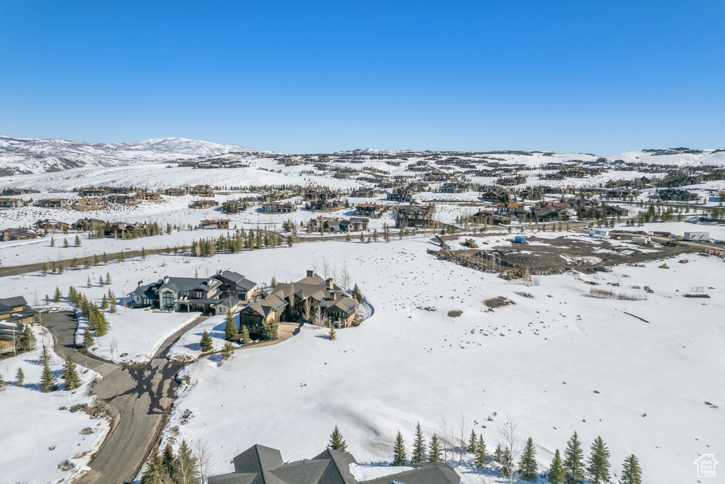 Snowy aerial view with a mountain view