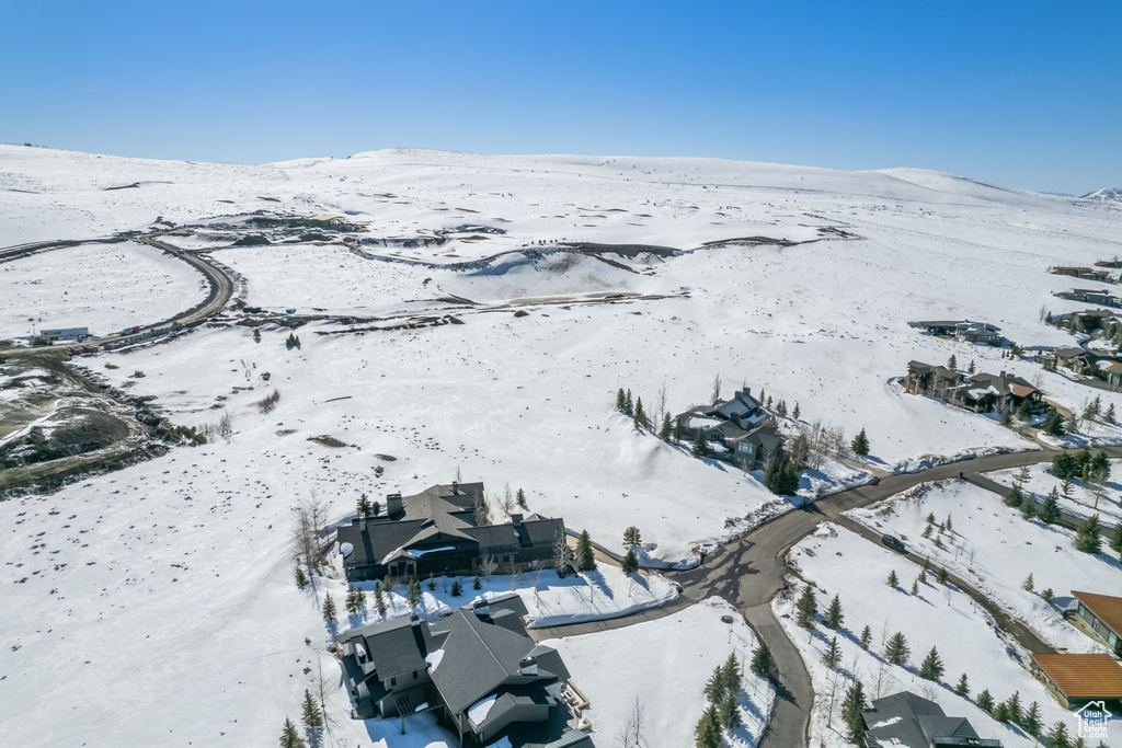 Snowy aerial view featuring a mountain view