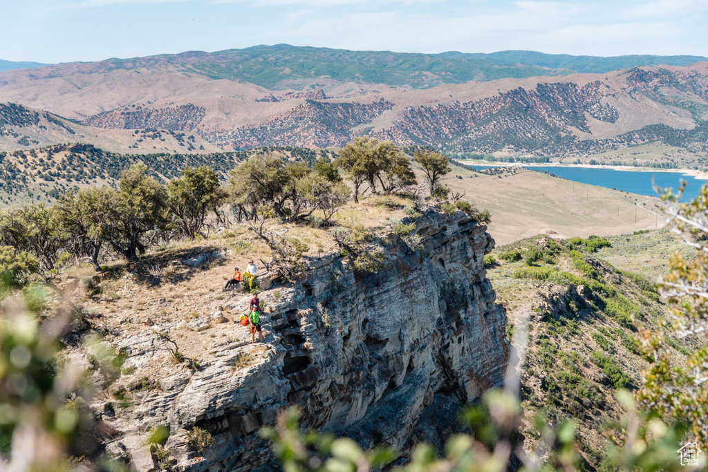 Property view of mountains featuring a water view