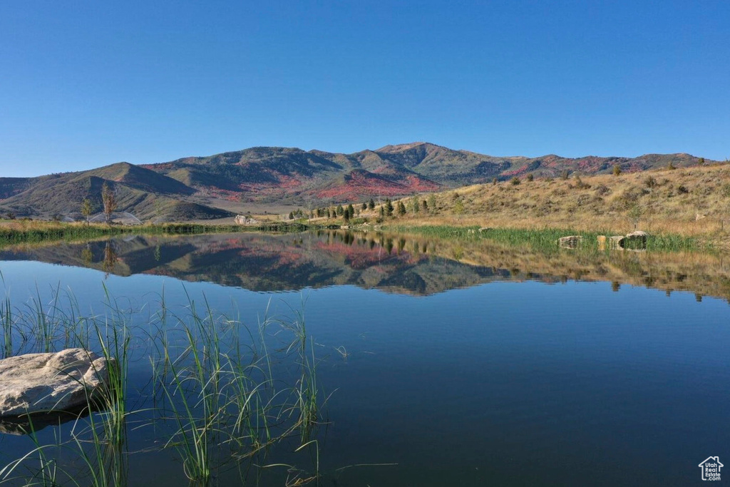 Property view of water with a mountain view