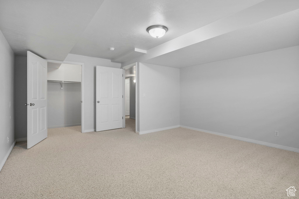 Basement with light carpet