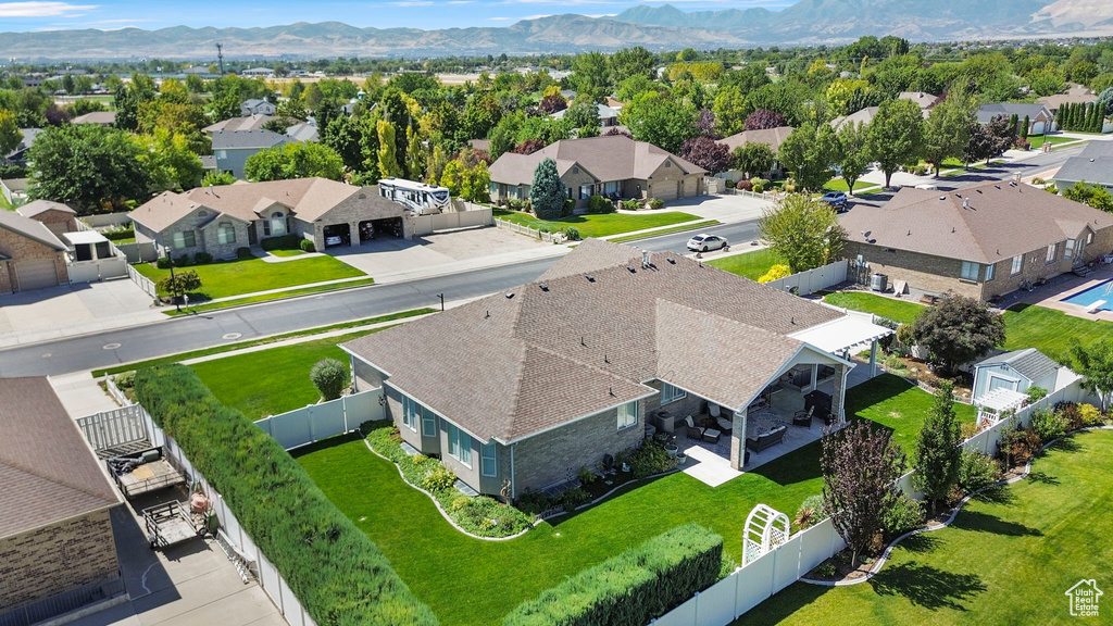 Birds eye view of property with a mountain view