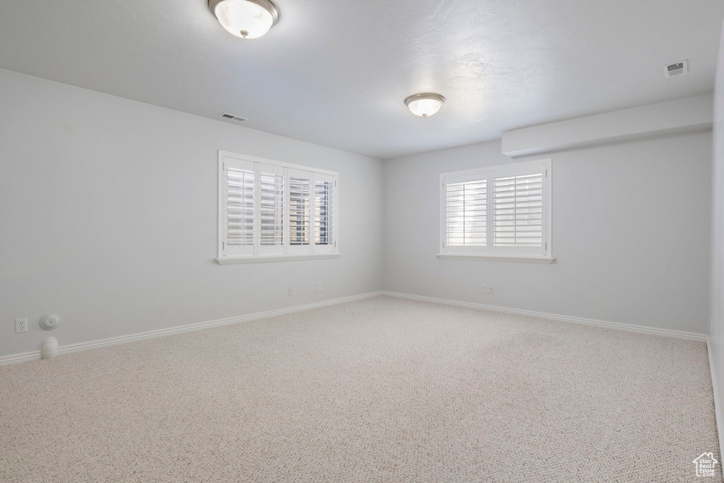 Spare room featuring carpet floors