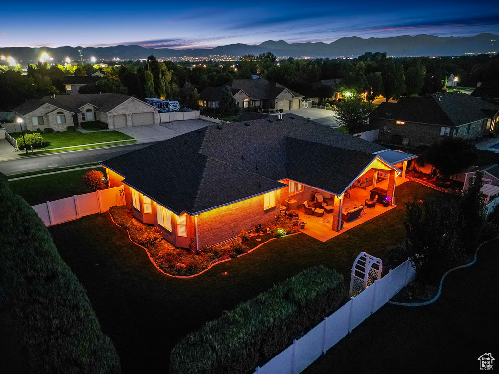 Aerial view at dusk featuring a mountain view