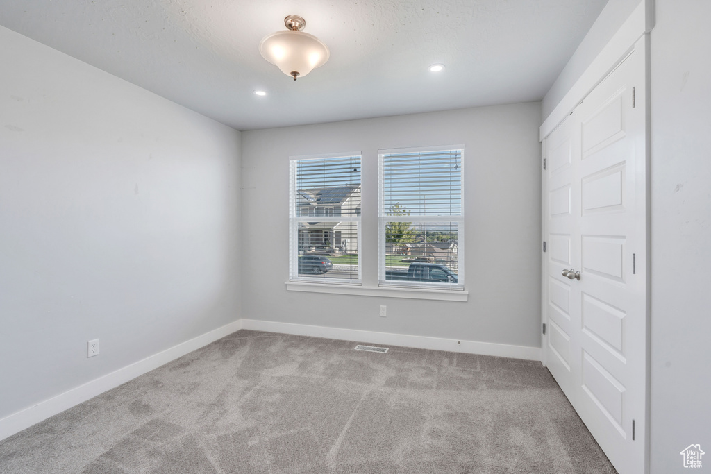 Unfurnished bedroom with carpet