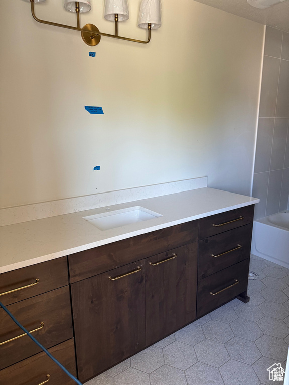 Bathroom with vanity and a bathtub