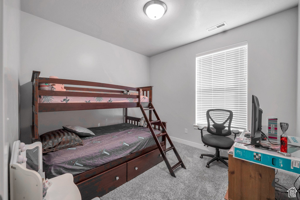 Bedroom with carpet flooring