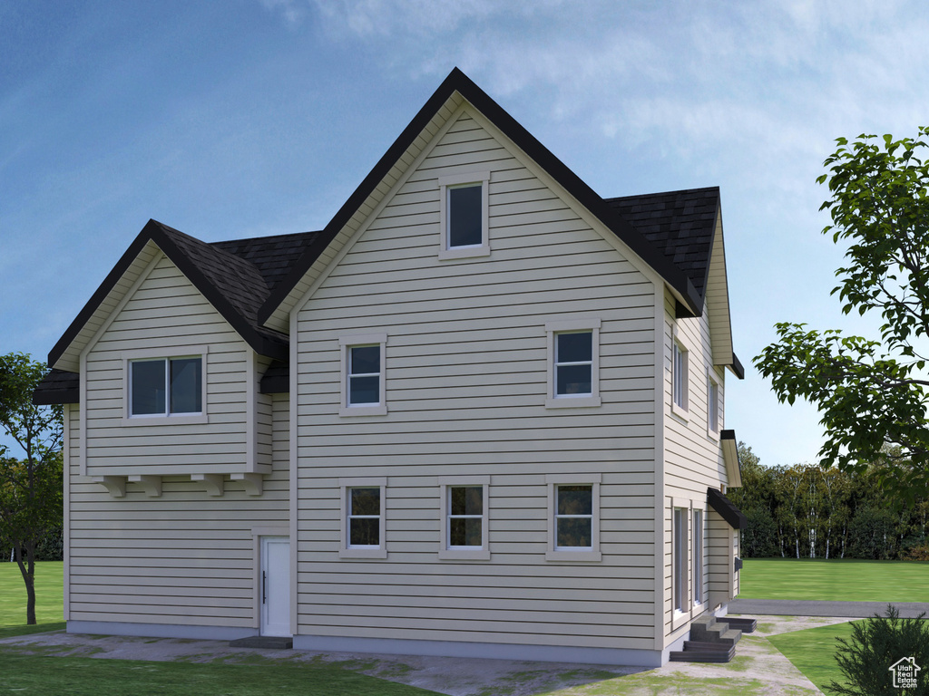 Rear view of house with a lawn