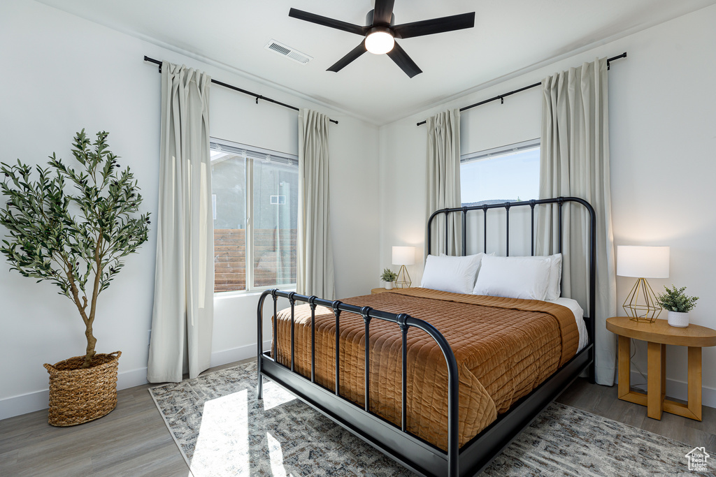 Bedroom featuring light hardwood / wood-style flooring and ceiling fan