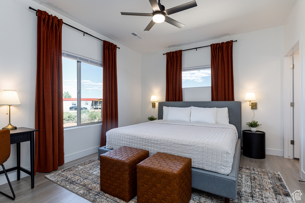 Bedroom featuring ceiling fan and light wood-type flooring