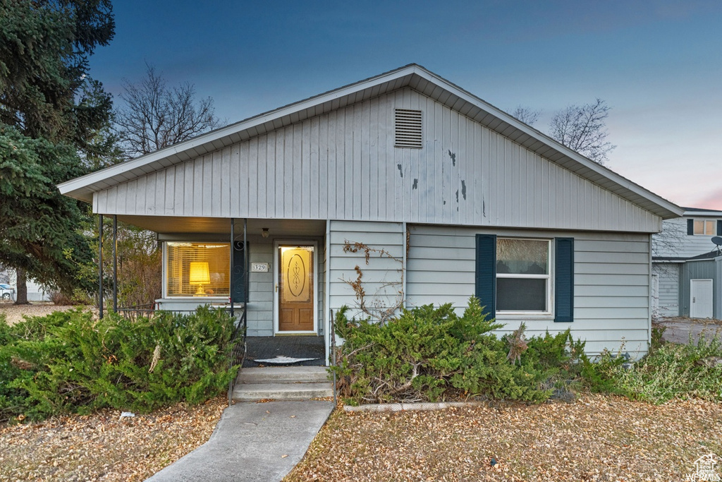 Bungalow-style home with a porch