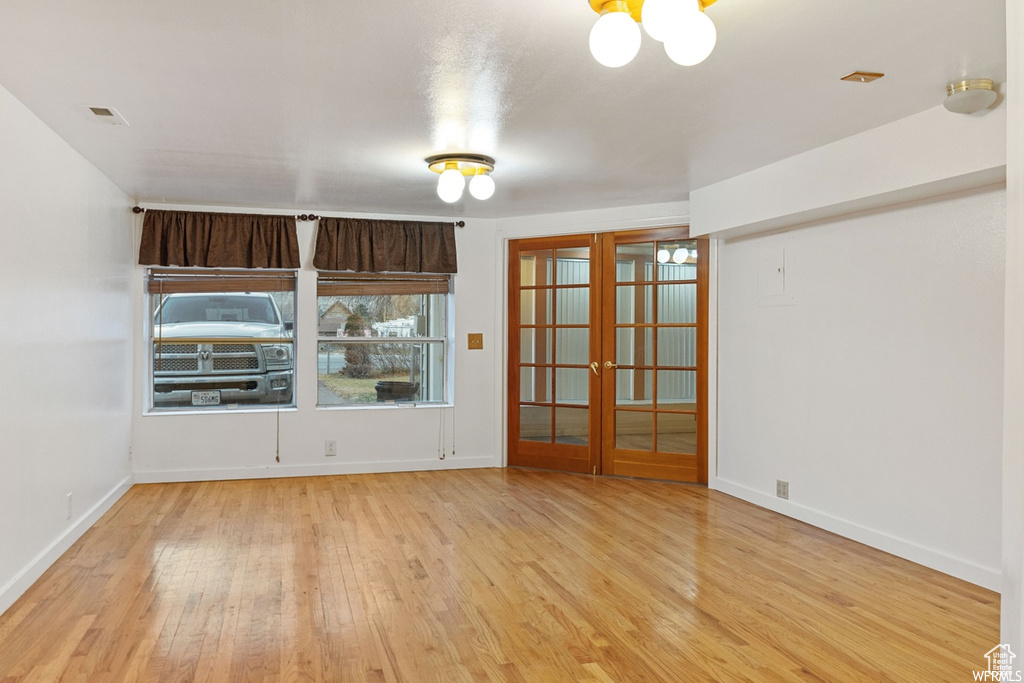 Spare room with light wood-type flooring