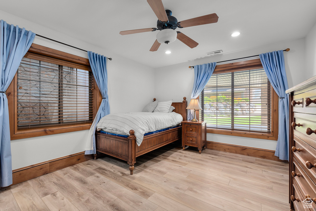 Bedroom featuring ceiling fan and light wood-type flooring