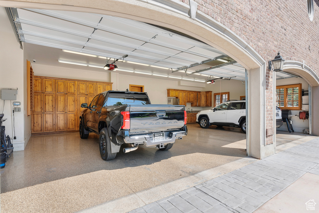 Garage featuring a garage door opener