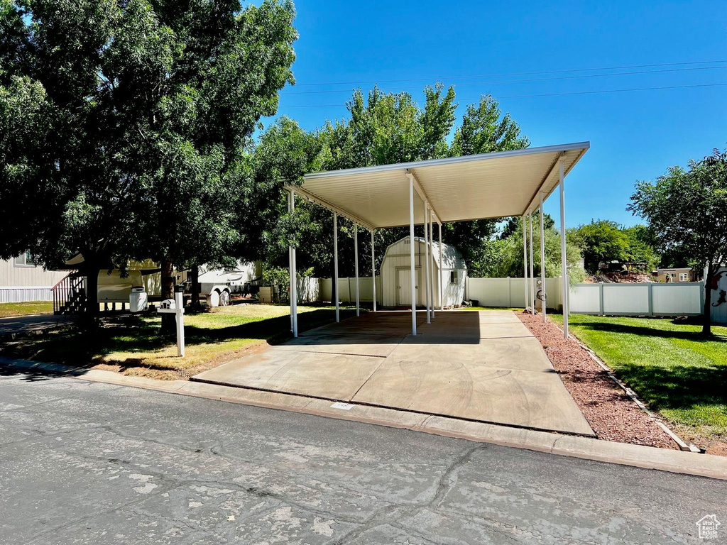 Surrounding community featuring a yard and a storage unit
