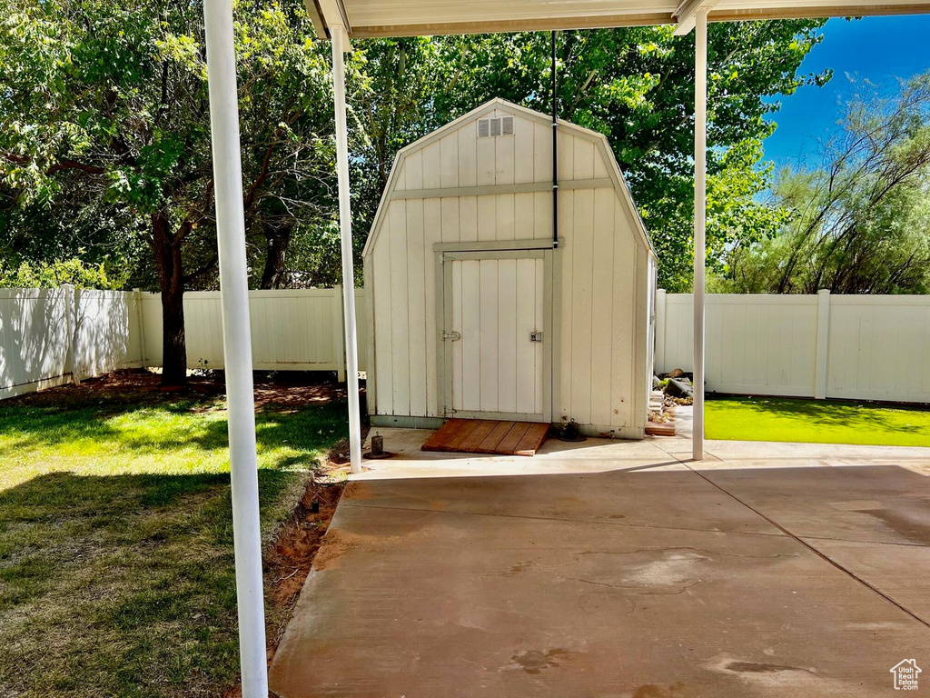 View of outdoor structure with a yard
