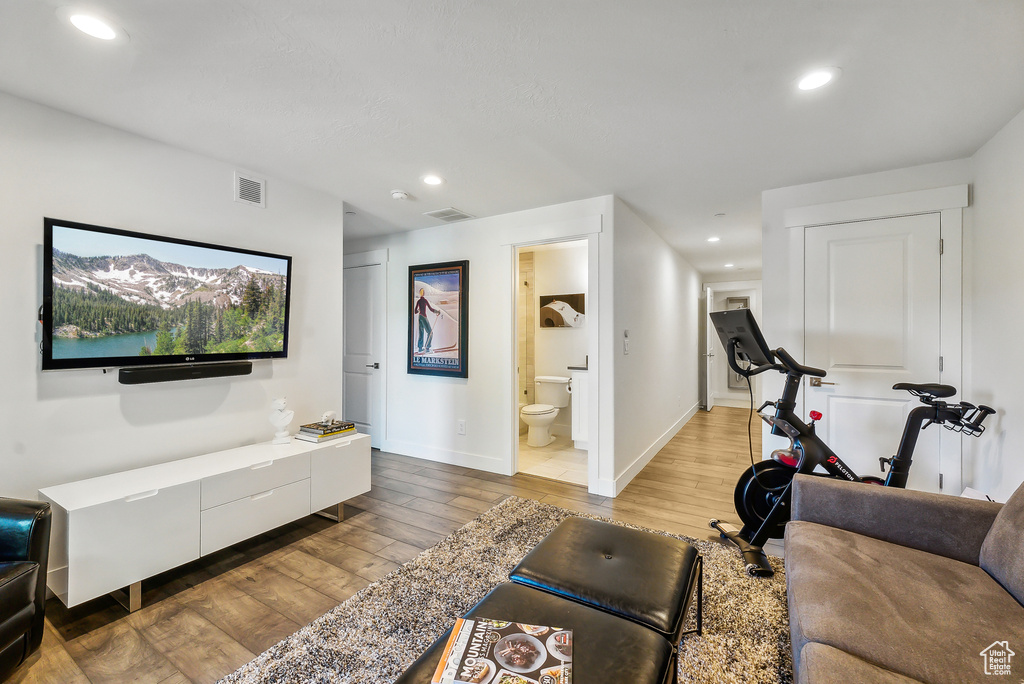 Living room with hardwood / wood-style flooring