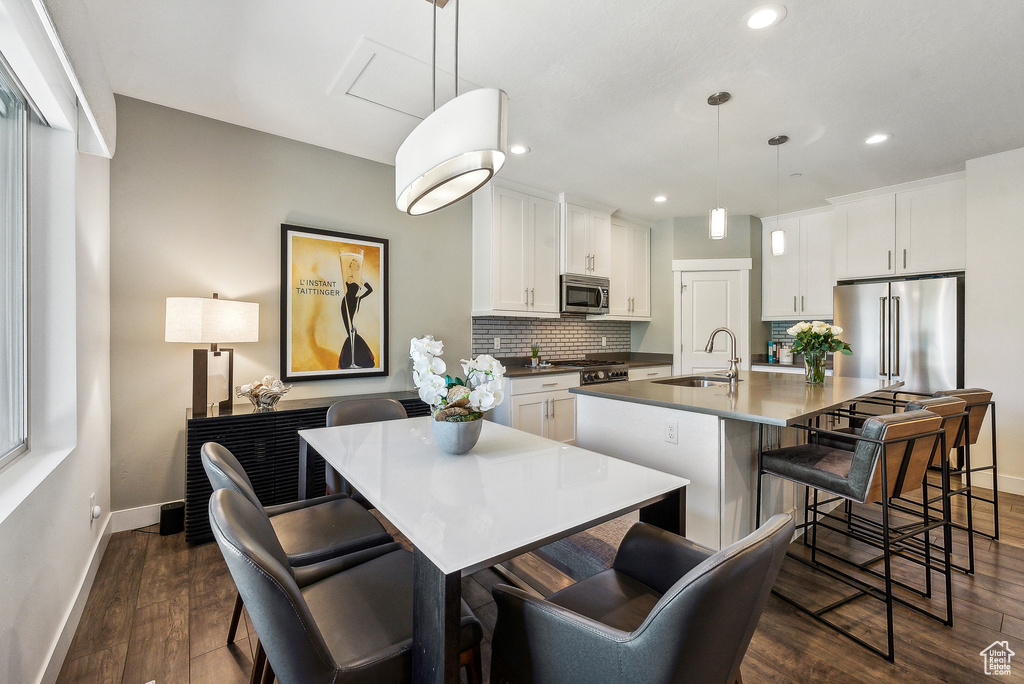 Interior space with dark hardwood / wood-style flooring and sink