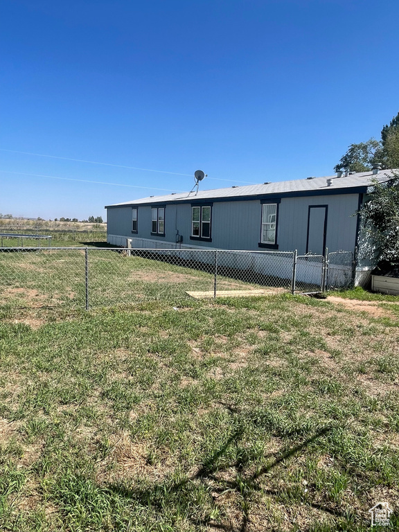 Exterior space featuring a yard