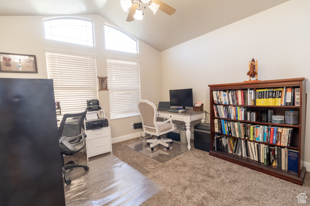 Office featuring ceiling fan, carpet floors, and vaulted ceiling